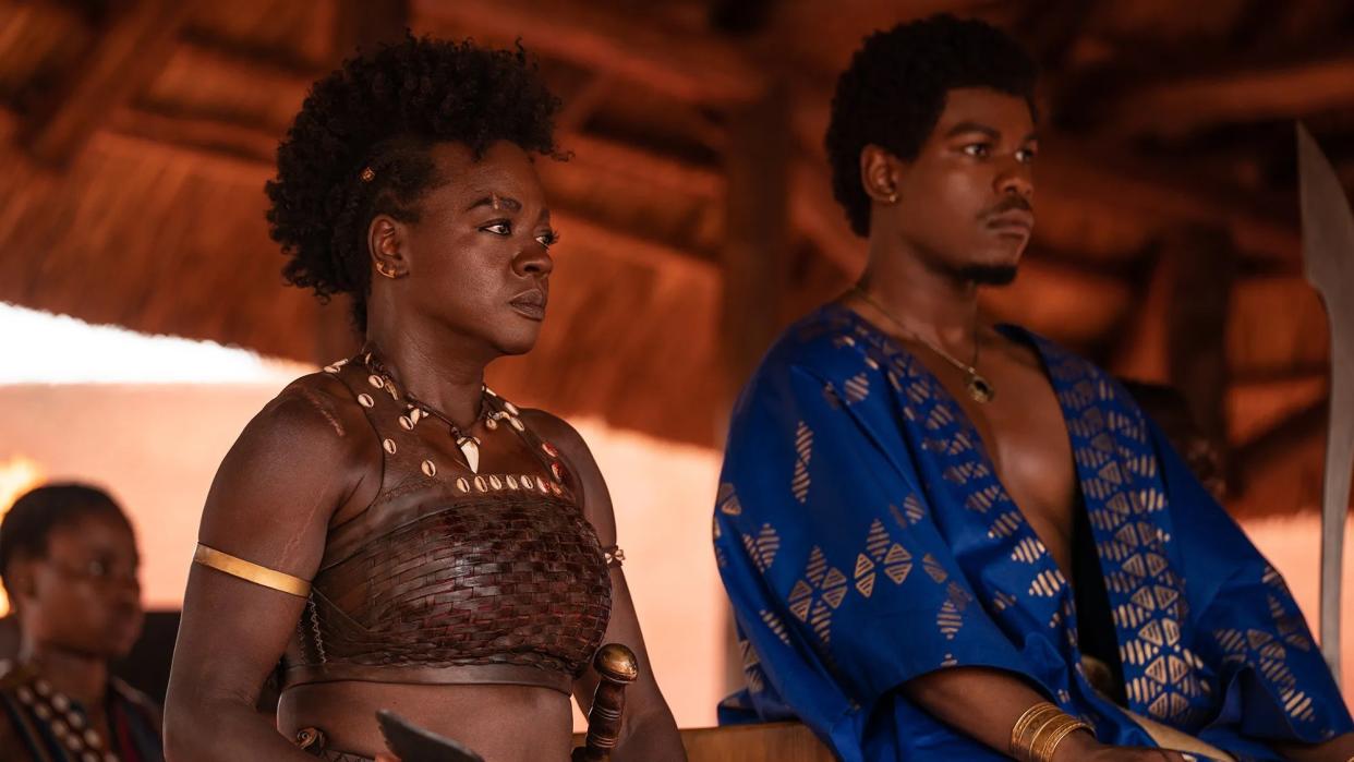  Viola Davis and John Boyega sitting alongside one another in The Woman King film 