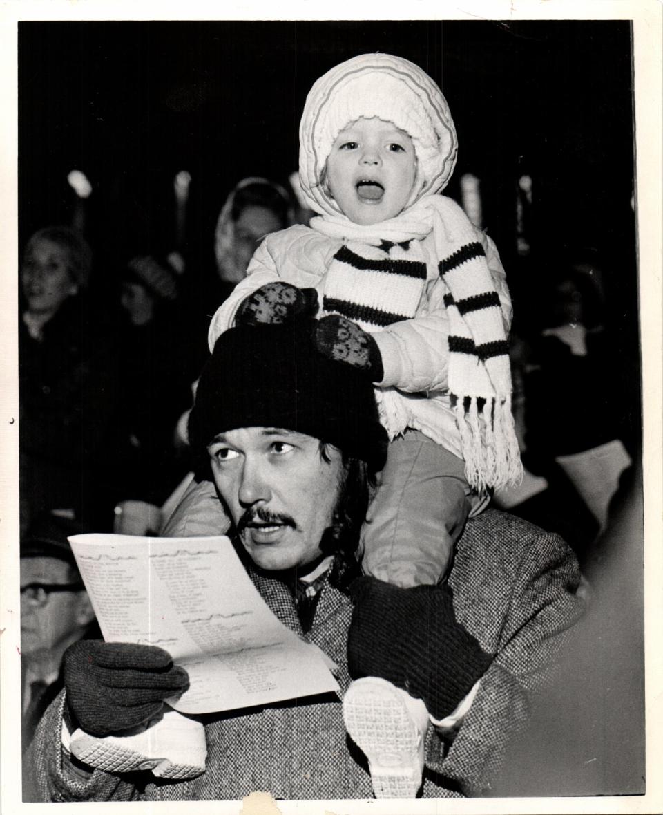 In a photo dated Dec. 19, 1972, carolers take part in the annual Action Line Christmas Carol Sing in downtown Detroit's Kennedy Square.The tradition started when Action Line received a letter asking why people didn't get together anymore to sing Christmas carols.