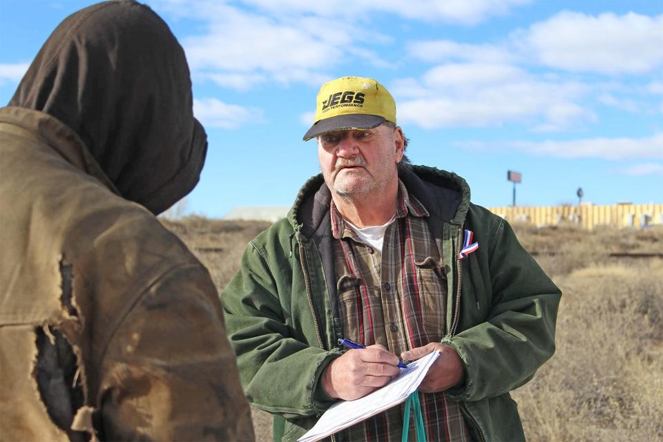 Jimmy Duffner, right, conducts a survey with a person experiencing homelessness for the point-in-time count in Pueblo on Jan. 28, 2023.