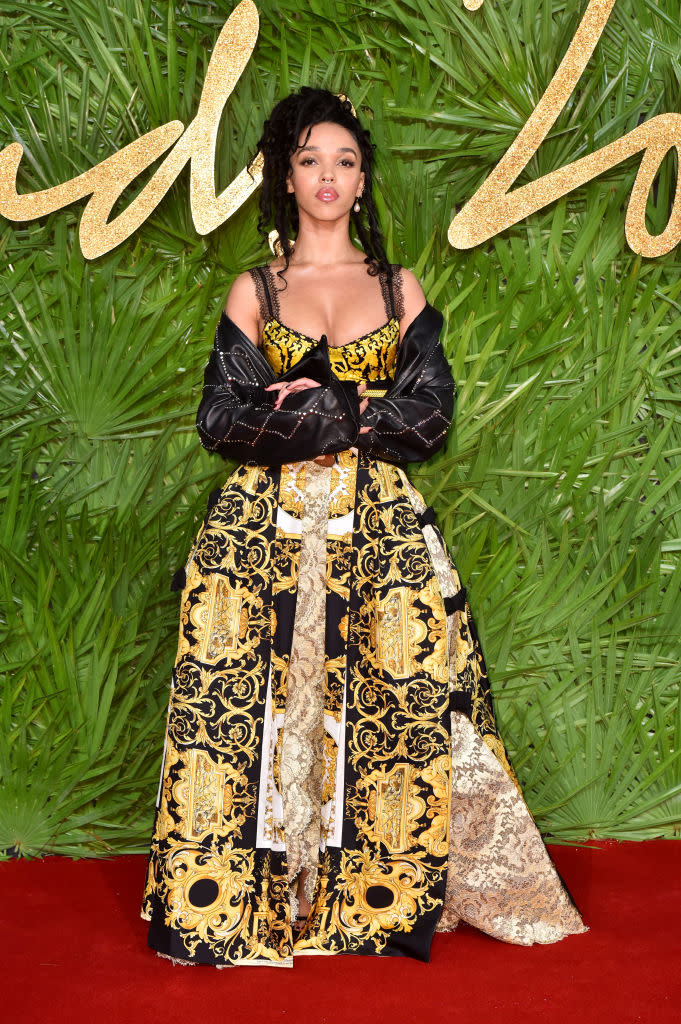 <p>FKA Twigs proved you can work denim on the red carpet as she draped a jacket over her printed gown. (Photo: Getty Images) </p>