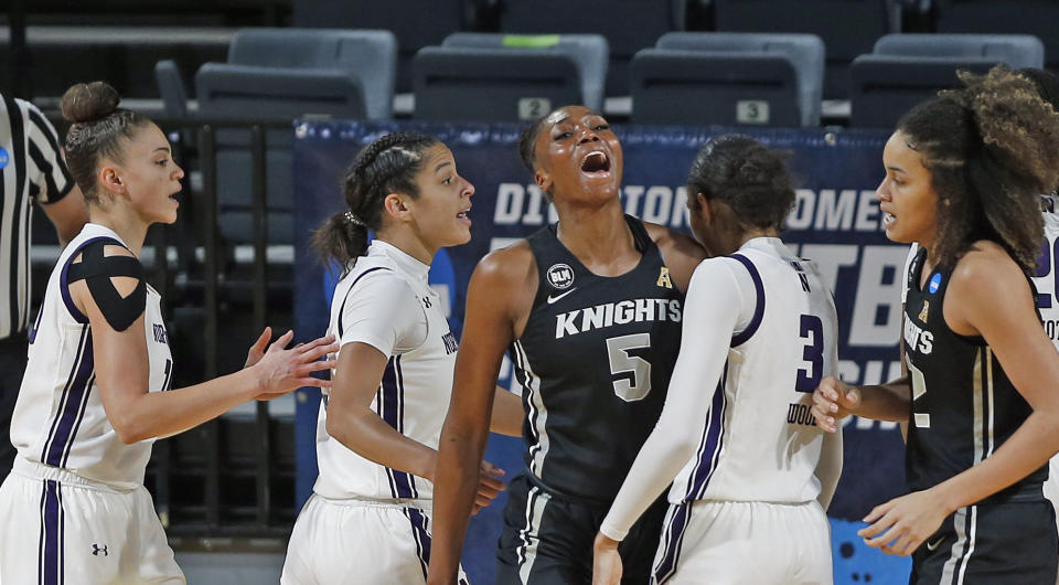 CORRECTS TO MONDAY, MARCH 22, 2021-UCF forward Masseny Kaba (5) reacts after a basket during the first half of a college basketball game in the first round of the women's NCAA tournament at the Greehey Arena in San Antonio, Texas, Monday, March 22, 2021. (AP Photo/Ronald Cortes)