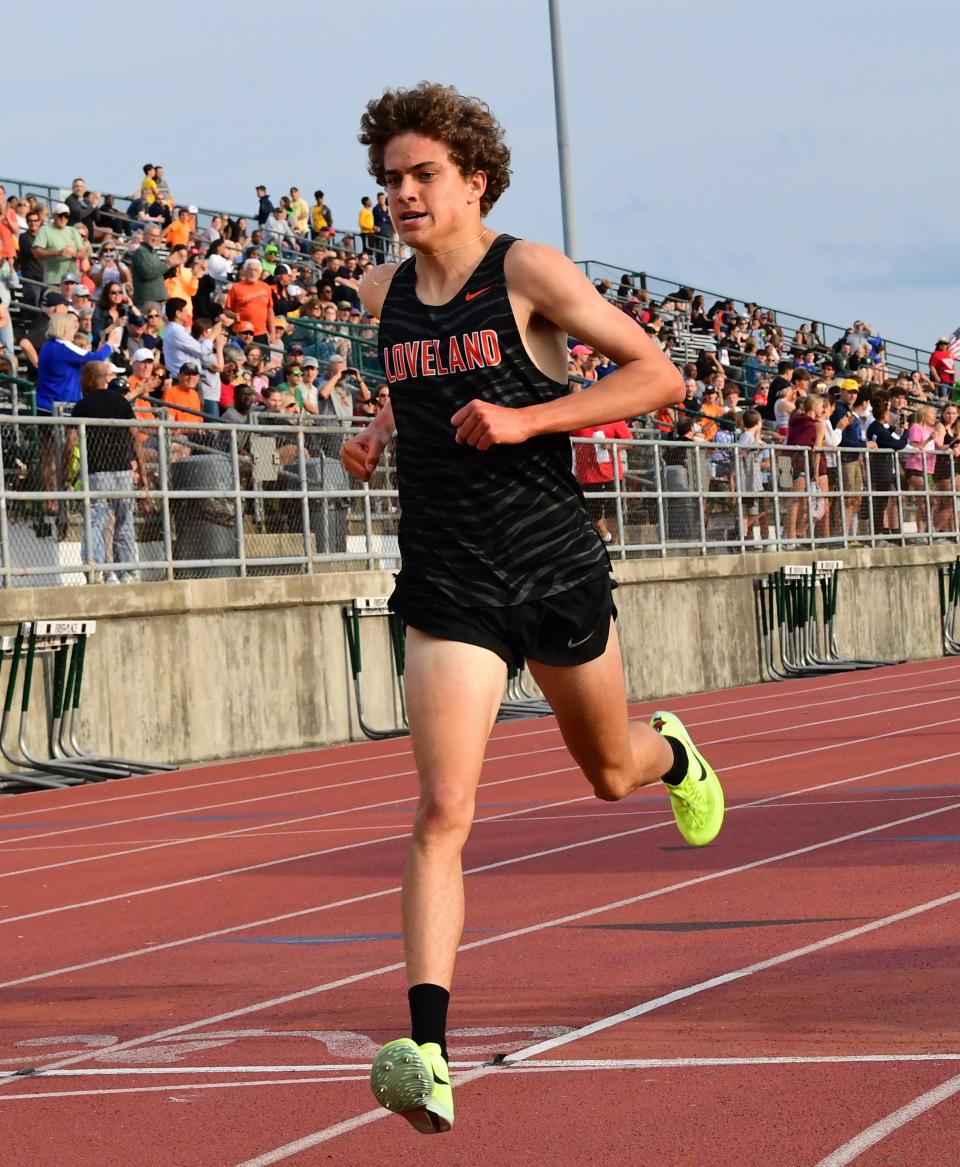 Cayden Dyer of Loveland, shown running in the district meet, won a regional title in the 1,600-meter race Friday.