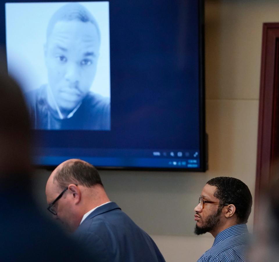 First degree murder trial of Marcus Avery Chamblin before Judge Terence Perkins at the Kim C. Hammond Justice Center in Bunnell, Tuesday, April 9, 2024. An image of Deon Jenkins, the man Chamblin killed, is shown on the screen.