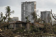 Buildings are surrounded by debris in the aftermath of Hurricane Otis in Acapulco, Mexico, Friday, Oct. 27, 2023. (AP Photo/Felix Marquez)