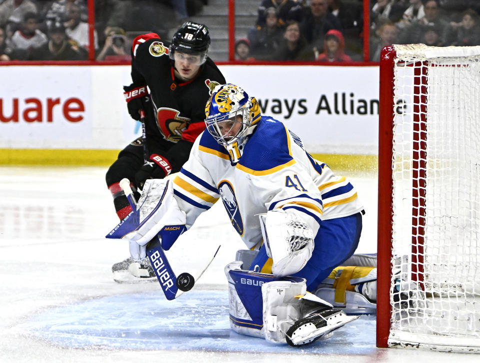 Buffalo Sabres goaltender Craig Anderson (41) makes a save as Ottawa Senators left wing Tim Stutzle looks on, during the second period of an NHL hockey game in Ottawa, Ontario, Sunday, Jan. 1, 2023. (Justin Tang/The Canadian Press via AP)