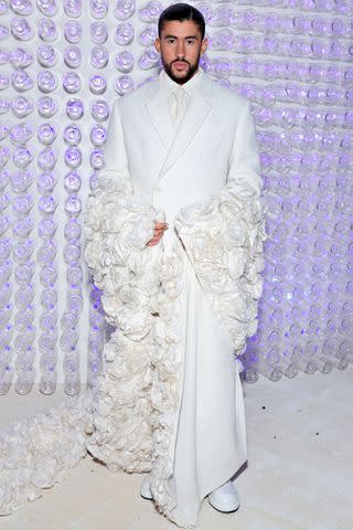 <p>Cindy Ord/MG23/Getty</p> Bad Bunny attends the 2023 Met Gala in New York City.