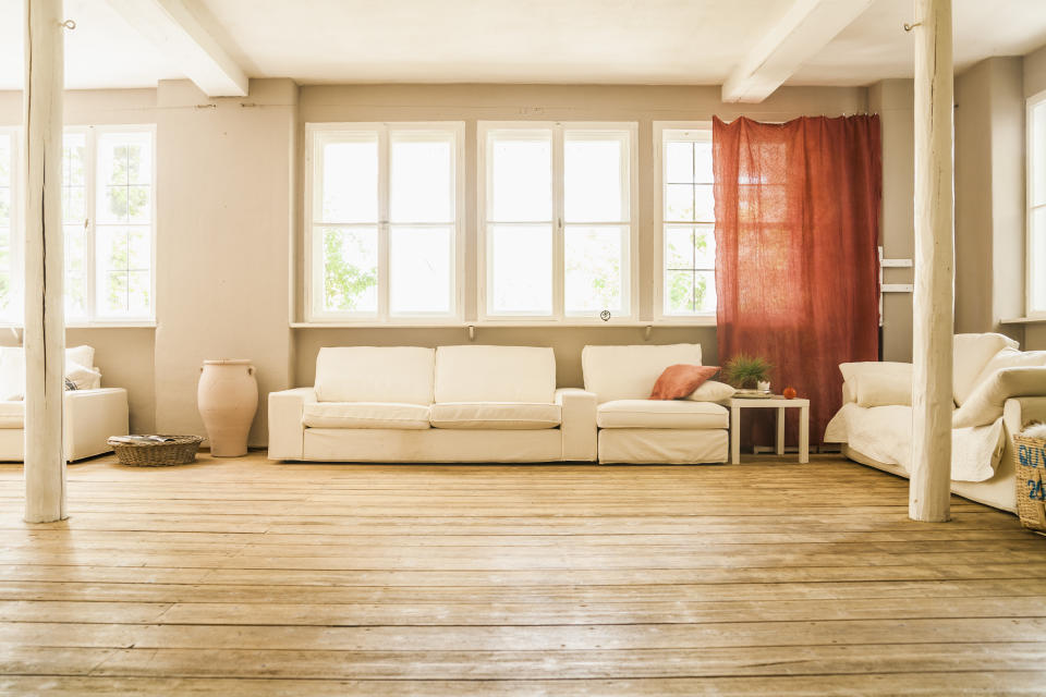 a loft apartment with a wooden floor