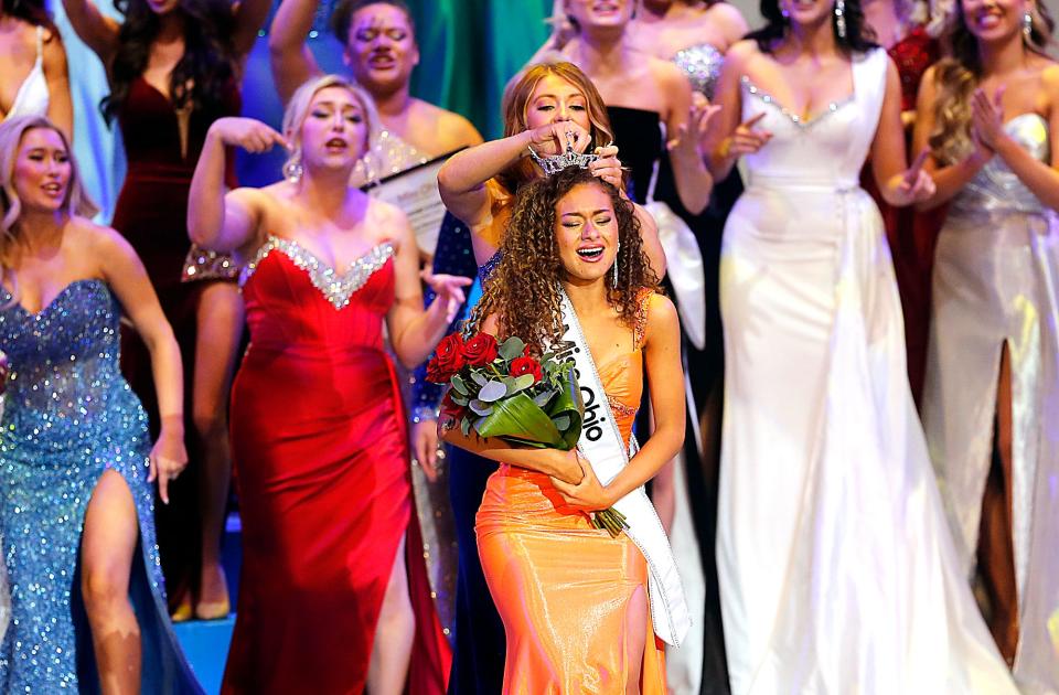 Miss Shawnee Stephanie Finoti is crowned Miss Ohio 2024 by Miss Ohio 2023 Madison Miller during the competition in the 2024 Miss Ohio Scholarship pageant Saturday, June 15, 2024. TOM E. PUSKAR/MANSFIELD NEWS JOURNAL