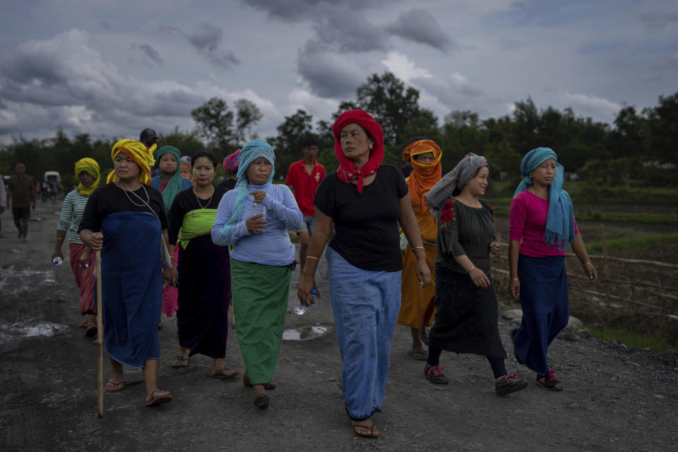 Members of Meira Paibis, powerful vigilante group of Hindu majority Meitei women, march toward a site of a gunfight in Kangchup, near Imphal, capital of the northeastern Indian state of Manipur, Thursday, Jun 22, 2023. A video that went viral late Wednesday, July 19, is emblematic of the deadly conflict in Manipur where ethnic clashes between two communities since May have left more than 130 people dead. The video shows two naked women being surrounded by scores of young men who grope their private parts and drag them to a nearby field. (AP Photo/Altaf Qadri)