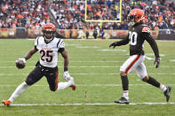 Cincinnati Bengals running back Chris Evans (25) scores a touchdown against Cleveland Browns cornerback Greg Newsome II (20) during the second half of an NFL football game, Sunday, Jan. 9, 2022, in Cleveland. The Browns won 21-16. (AP Photo/David Richard)