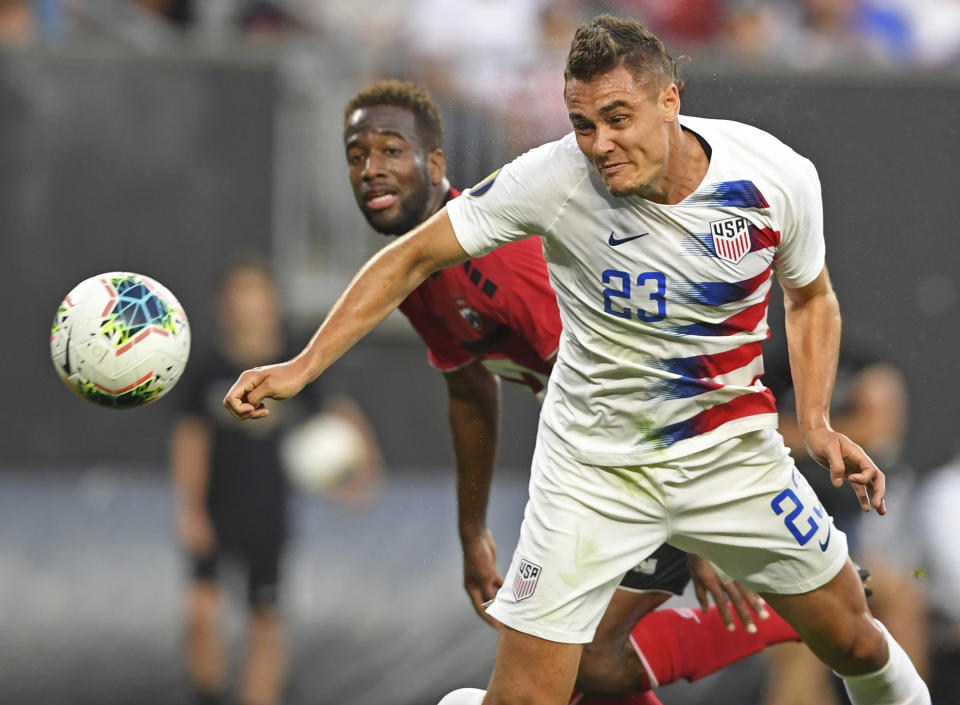 U.S. defender Aaron Long heads the ball in for a goal during the first half of the team's CONCACAF Gold Cup soccer match against Trinidad and Tobago, Saturday, June 22, 2019, in Cleveland. (AP Photo/David Dermer)