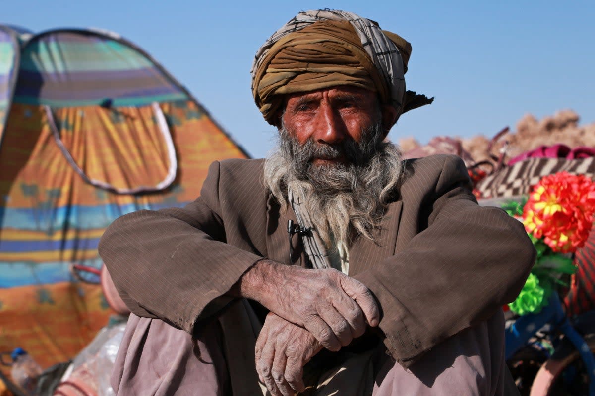 An Afghan resident sits near his damaged house after earthquake in Nayeb Rafi village, Zendeh Jan district of Herat province (AFP/Getty)