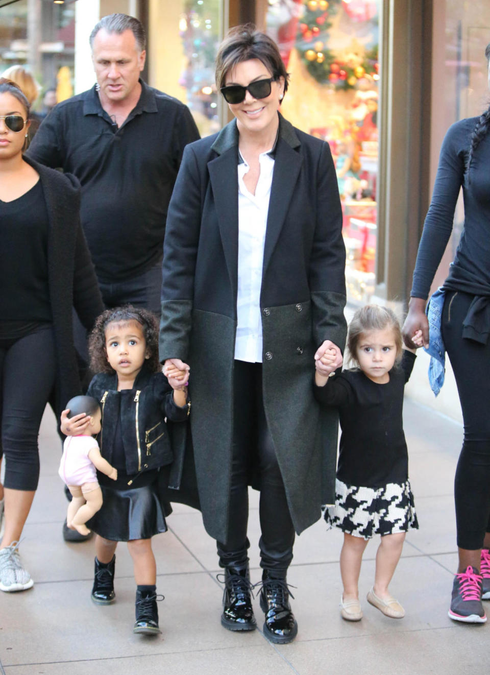 North West, Kris Jenner and Penelope Disick hold hands while shopping at The Grove in Los Angeles, Calif.