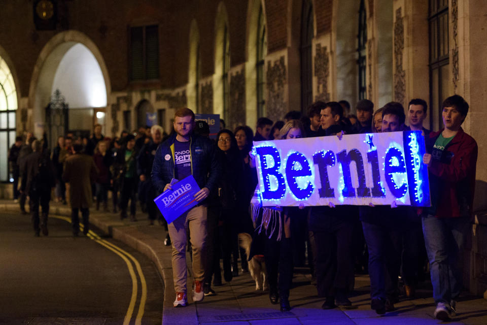 LONDON, ENGLAND - MARCH 01:  Supporters of American Democrat candidate Bernie Sanders carry a sign with the slogan 'Bernie 2016' as they march to a local polling station during a Super Tuesday rally in Parliament Square on March 1, 2016 in London, England. Super Tuesday is a day in the United States presidential primary season where a large number of states hold their primary elections. American citizens abroad are allowed to vote for their chosen candidate at local polling centres. (Photo by Ben Pruchnie/Getty Images)