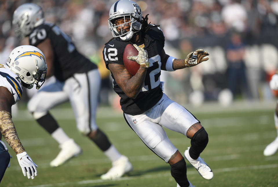 OAKLAND, CA - NOVEMBER 11:  Martavis Bryant #12 of the Oakland Raiders runs with the ball after catching a pass against the Los Angeles Chargers during the first half of their NFL football game at Oakland-Alameda County Coliseum on November 11, 2018 in Oakland, California.  (Photo by Thearon W. Henderson/Getty Images)