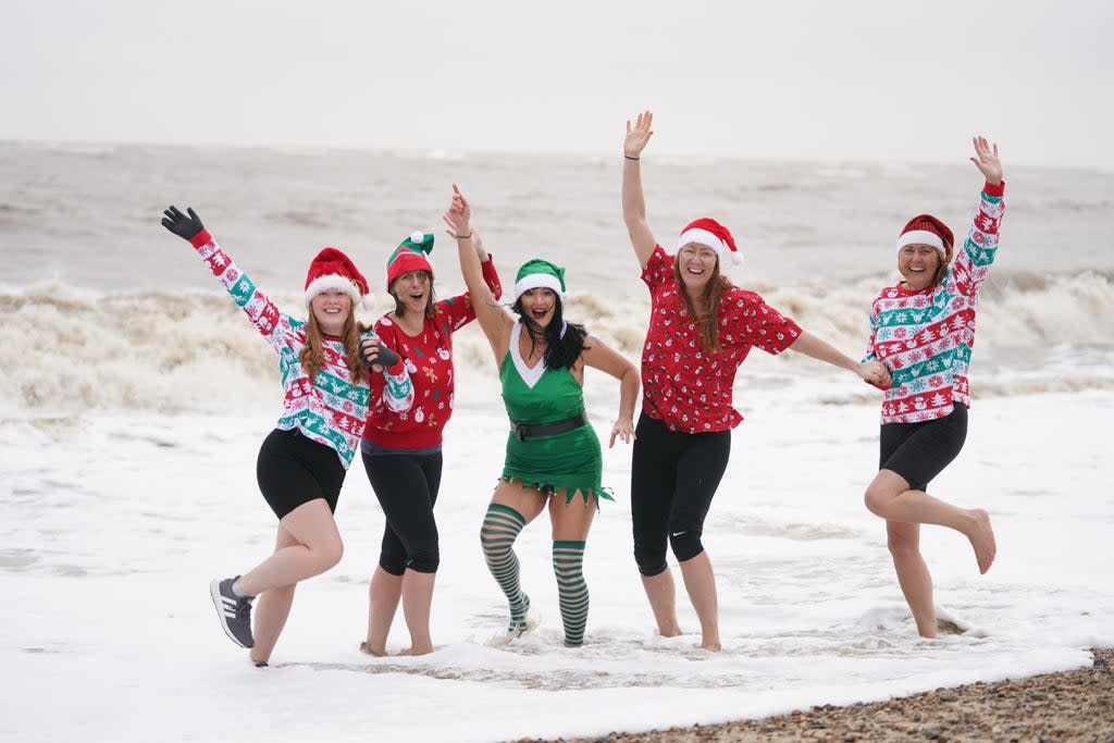 Swimmers pose in the sea at Felixstowe, Suffolk (Joe Giddens/PA) (PA Wire)