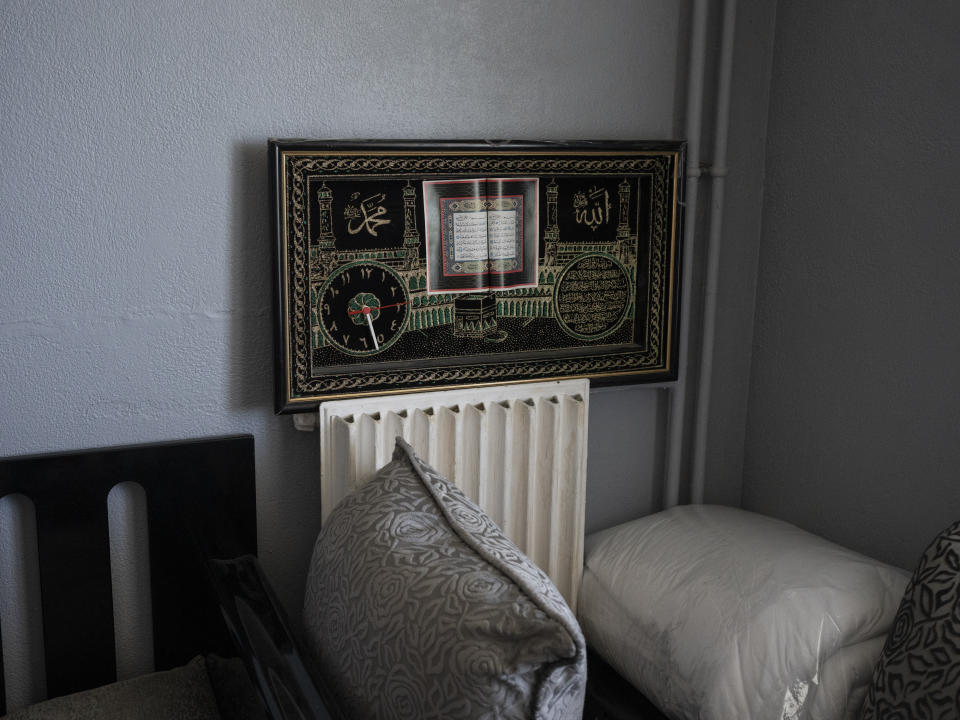 An Islamic icon depicting Mecca is displayed in the Ould Ibbat family's home in Marseille, southern France, Sunday, April 21, 2024. (AP Photo/Daniel Cole)