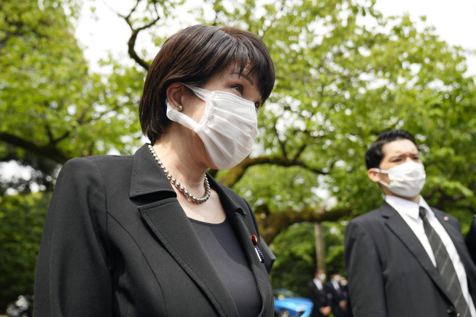 Japan's Economic Security Minister Sanae Takaichi meets the media after visiting Yasukuni Shrine in Tokyo, Monday, Aug. 15, 2022. The shrine is seen as a symbol of Japanese militarism because it honors convicted war criminals among about 2.5 million war dead. (Kyodo News via AP)