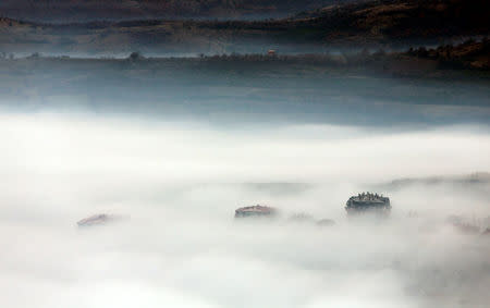 Buildings are seen as fog blankets the city of Skopje, Macedonia December 15, 2017. REUTERS/Ognen Teofilovski