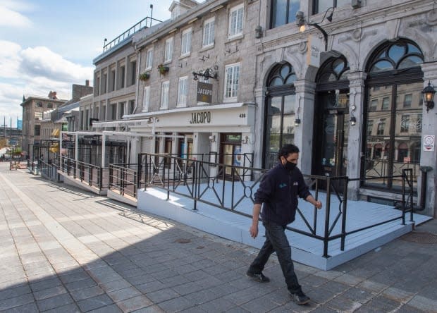 A major business lobby group in Quebec says a vaccine passport system could help revitalize downtowns decimated by the pandemic.  (Ryan Remiorz/The Canadian Press - image credit)