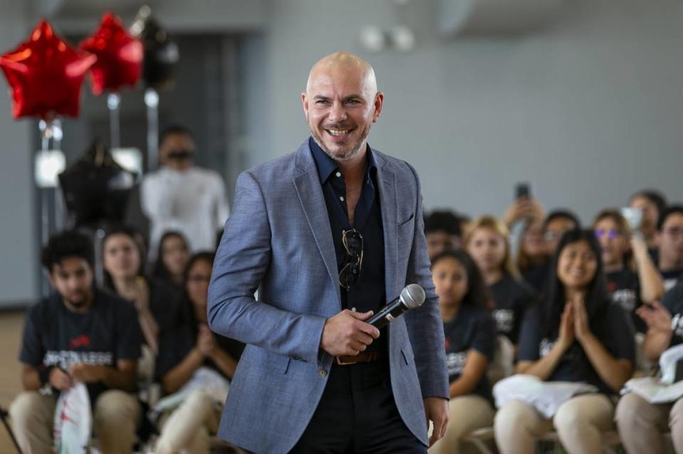 Armando “Pitbull” Perez gives a motivational talk to a group of students on College Signing Day at SLAM! Academy Miami in April 2019.