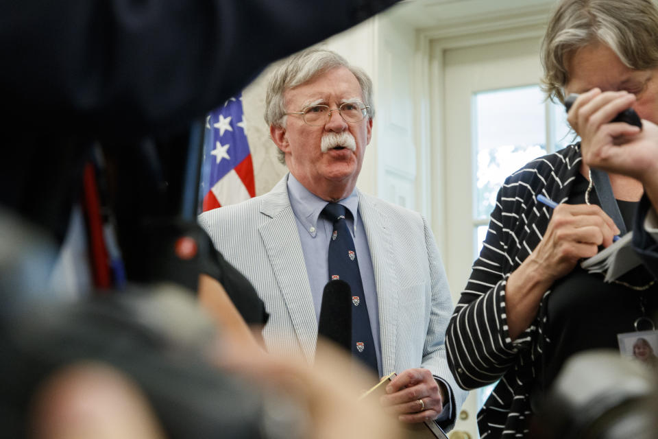 FILE - In this July 19, 2019, file photo, then-National security adviser John Bolton speaks at the request of President Donald Trump during a photo opportunity in the Oval Office of the White House in Washington. Top officials in the White House were aware in early 2019 of classified intelligence indicating Russia was secretly offering bounties to the Taliban for the deaths of Americans, a full year earlier than has been previously reported. That's according to U.S. officials with direct knowledge of the intelligence. Bolton also told colleagues he briefed Trump on the intelligence assessment in March 2019. (AP Photo/Alex Brandon, File)