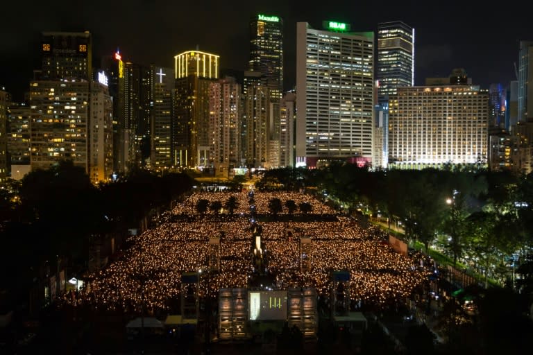 People take part in a candlelight vigil in Hong Kong on June 4, 2015, to mark the crackdown on the pro-democracy movement in Beijing's Tiananmen Square in 1989