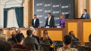 On Friday October 6, 2023, Beam Global signed an agreement to acquire Europe Based Amiga DOO. Signatories shown at podium from left to right: Desmond Wheatley, Beam Global CEO; Ivan Tlacinac, Amiga CEO and Co-Owner and Jelena Spasojevic, Amiga Co-Owner.