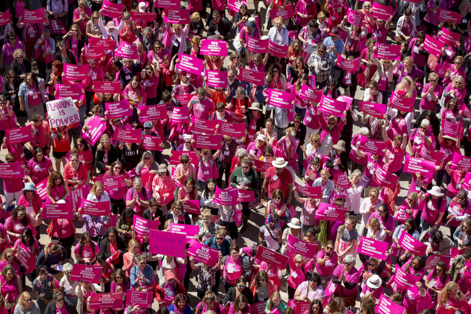 FILE - In this Wednesday, April 5, 2017 file photo, demonstrators participate in a rally for Planned Parenthood at the Capitol in Austin, Texas. A network of eight Christian pregnancy centers in Texas will provide contraceptive options next year as it vies for federal funding Planned Parenthood relinquished earlier this summer. The Source will take the unprecedented step of offering women pills, injections, and intrauterine devices while the organization looks to build an additional 20 clinics across Texas. The Source Chief Executive Andy Schoonover says the organization is focused on being proactive in reducing unplanned pregnancies. (Jay Janner/Austin American-Statesman via AP, File)