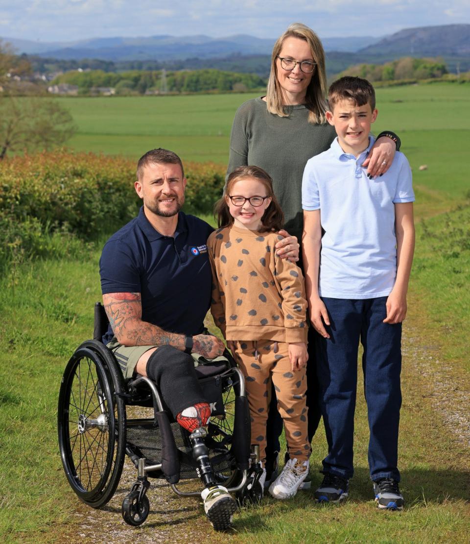 ‘Every single day I go out to prove to my children that I can get on with things’: Robinson with his family