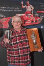 <em>Two-time Indy 500 winner Gordon Johncock displays his Baby Borg at an April 24 ceremony (Dan R. Boyd for BorgWarner).</em>