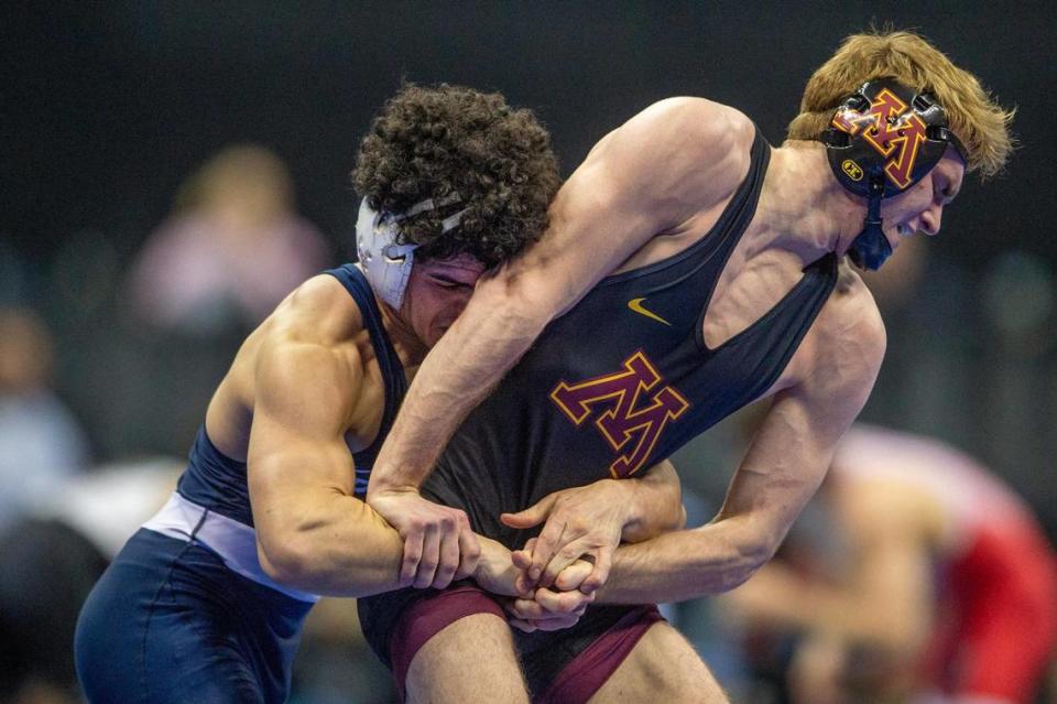 Beau Bartlett of Penn State wrestles Vance Vombaur of the University of Minnesota during the quarterfinals of the Men’s Division I NCAA Wrestling Championships at T-Mobile Center on Friday, March 22, 2024, in Kansas City.