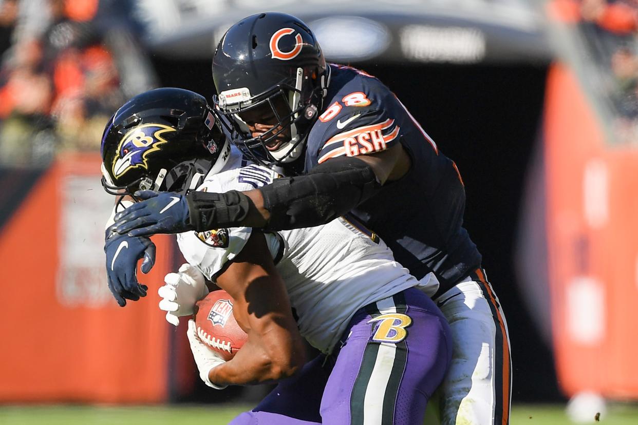 Chicago Bears inside linebacker Roquan Smith (58) tackles Baltimore Ravens wide receiver Devin Duvernay (13) in the first half at Soldier Field.