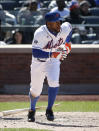 New York Mets Eric Young Jr. watches his seventh-inning triple in the Mets' 4-1 victory over the St. Louis Cardinals in a baseball game in New York, Thursday, April 24, 2014. (AP Photo/Kathy Willens)