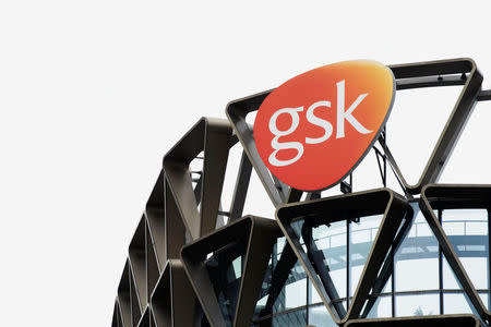 The GlaxoSmithKline (GSK) logo is seen on top of GSK Asia House in Singapore, March 21, 2018. REUTERS/Loriene Perera