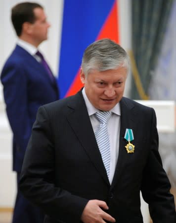 FILE PHOTO: Former Russian chess world champion Karpov walks away from Russia's President Medvedev during an awarding ceremony in Moscow's Kremlin