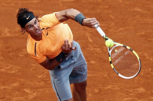 Spain's Rafael Nadal hits a return to Kazakhstan's Mikhail Kukushkin during the Monte-Carlo ATP Masters Series Tournament tennis match, in Monaco. Nadal won 6-1, 6-1 in exactly one hour