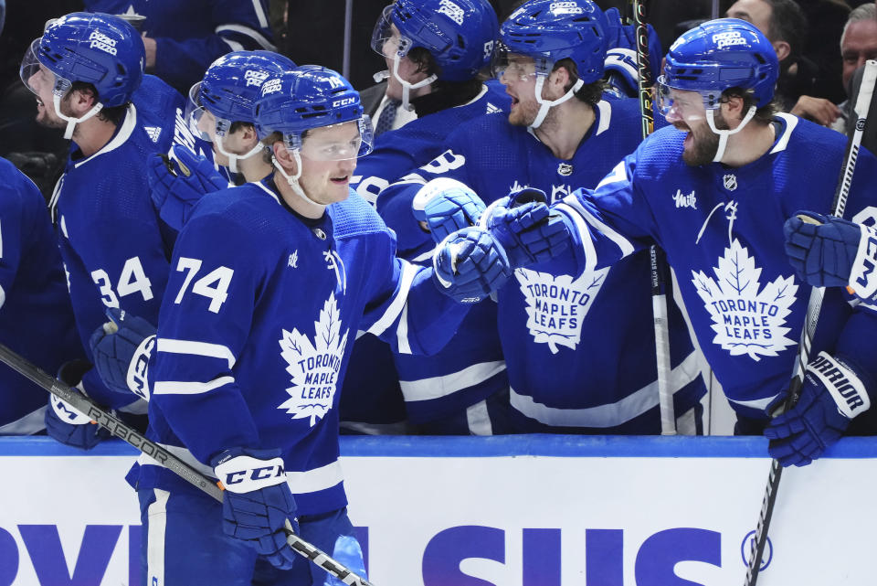Toronto Maple Leafs forward Bobby McMann (74) celebrates his third goal against the St. Louis Blues during the third period of an NHL hockey game, Tuesday, Feb. 13, 2024 in Toronto. (Nathan Denette/The Canadian Press via AP)