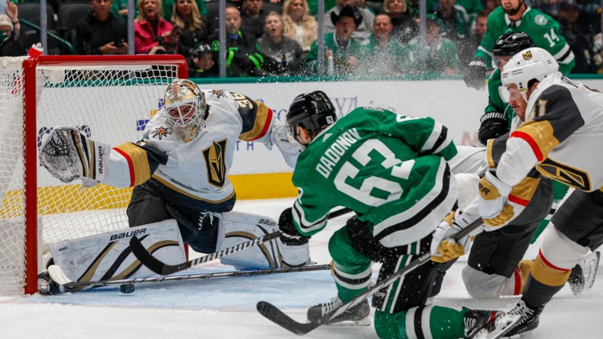 <div>DALLAS, TX - DECEMBER 09: Dallas Stars right wing Evgenii Dadonov (63) shoots and scores a goal against Vegas Golden Knights goaltender Logan Thompson (36) during the game between the Dallas Stars and the Vegas Golden Knights on December 9, 2023 at American Airlines Center in Dallas, Texas. (Photo by Matthew Pearce/Icon Sportswire via Getty Images)</div>