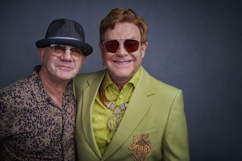 Elton John (right) recently became and EGOT winner and in 2023 inducted Bernie Taupin (left) into the Rock & Roll Hall of Fame. Now the pair will be honored with the Gershwin Prize for Song.