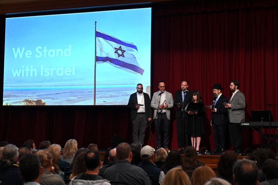 Rabbis from major area Jewish congregations read a prayer for Israel at a community solidarity rally for Israel on Monday, Oct. 9, 2023, at the Gordon Jewish Community Center. From left to right, Rav Natan Freller, and Rabbis Saul Strosberg, Michael Danziger, Shana Mackler, Yitzchok Tiechtel and Joshua Kullock. The rabbis represent West End Synagogue, Congregation Sherith Israel, The Temple, and Chabad of Nashville.