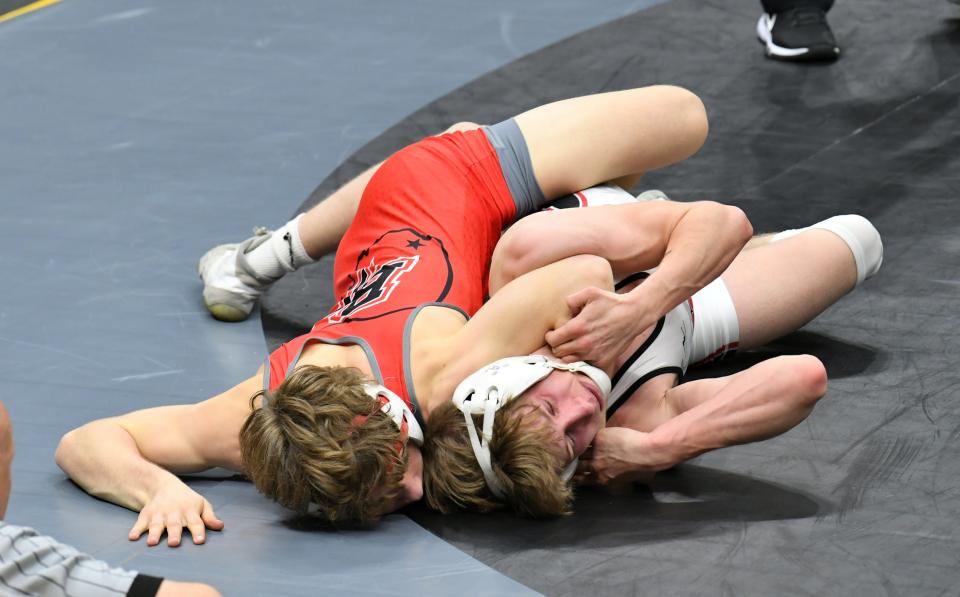 Logan Dean, left, of Bethel-Tate gains quick control in his first match at 120 pounds against Cameron Wagers of Plymouth in the opening round of the Division III, 2024 OHSAA Wrestling State Tournament, Columbus, Ohio, March 8, 2024.