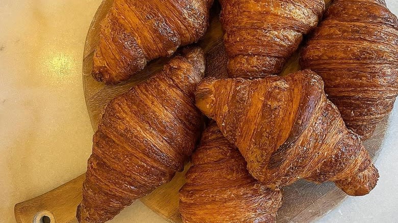 croissants on wooden board