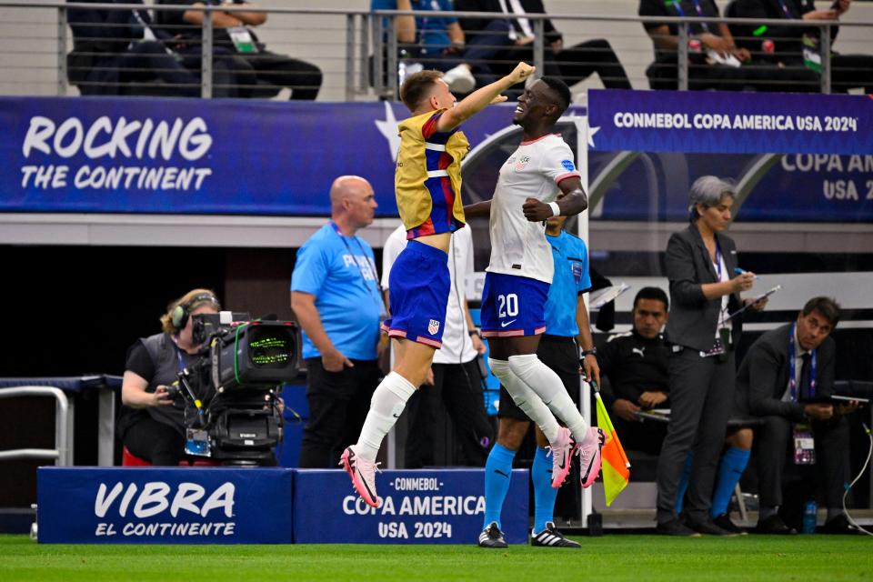 Folarin Balogun (right) and USMNT teammate Kristoffer Lund celebrate after Balogun scored a goal against Bolivia.