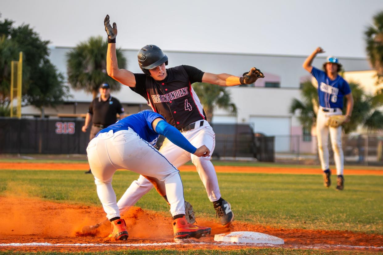 Vero Beach's Chase Wilson (4) tries to dodge the tag from Wellington's Daniel Goncalves (11) in a high school baseball Region 3-7A semifinal on Friday, May 10, 2024, at Vero Beach High School.