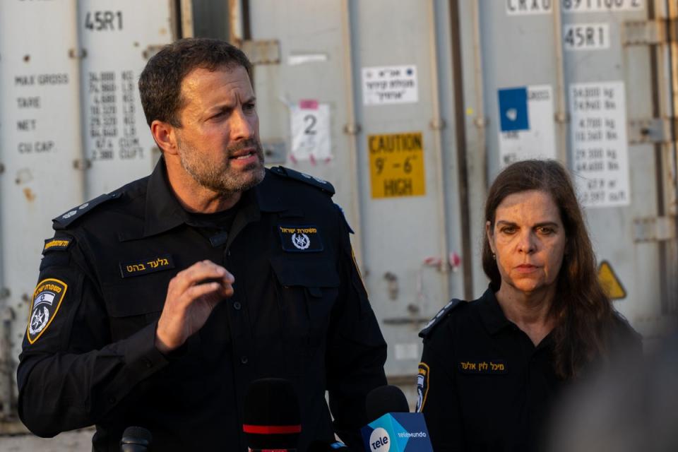 Israeli police officer Gilad Behat, left, with Dr Michal Levin-Elad (Getty)