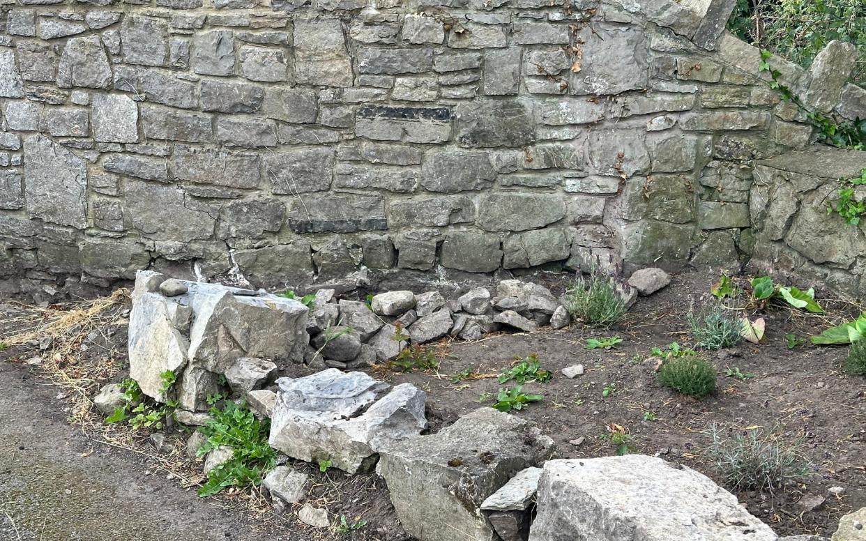 The small area before the community created a raised flowerbed to ready the village for Britain in Bloom