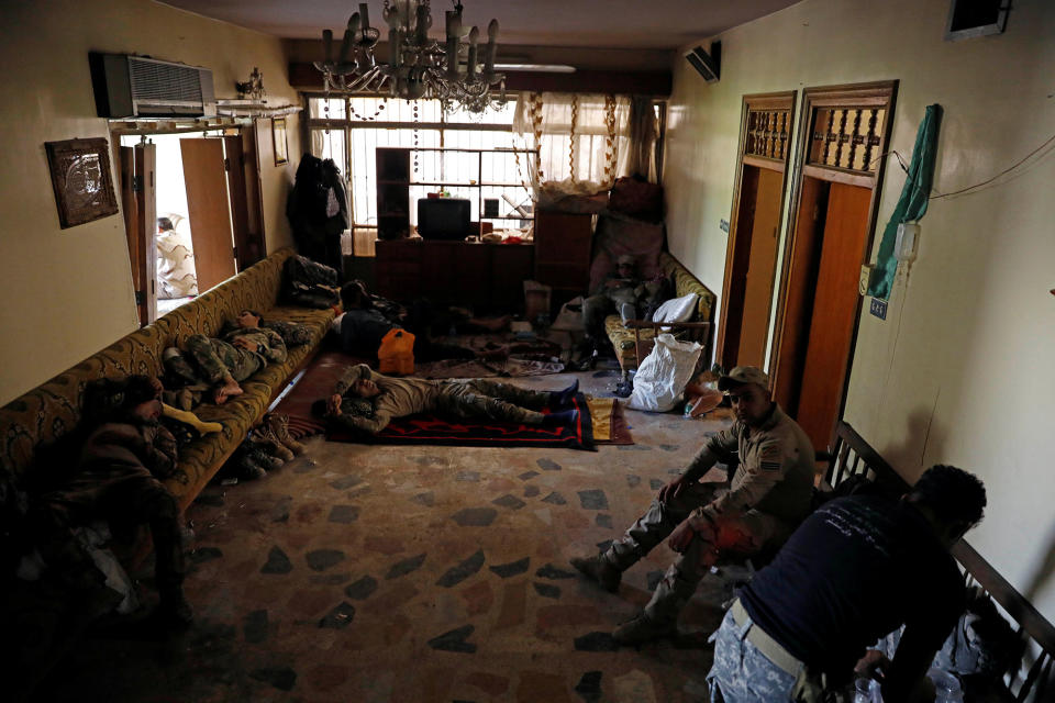 <p>Iraqi soldiers from 9th Armoured Division rest inside a house that has become their temporary advance command post in the Shifa neighbourhood in western Mosul, Iraq, June 15, 2017. (Photo: Erik De Castro/Reuters) </p>