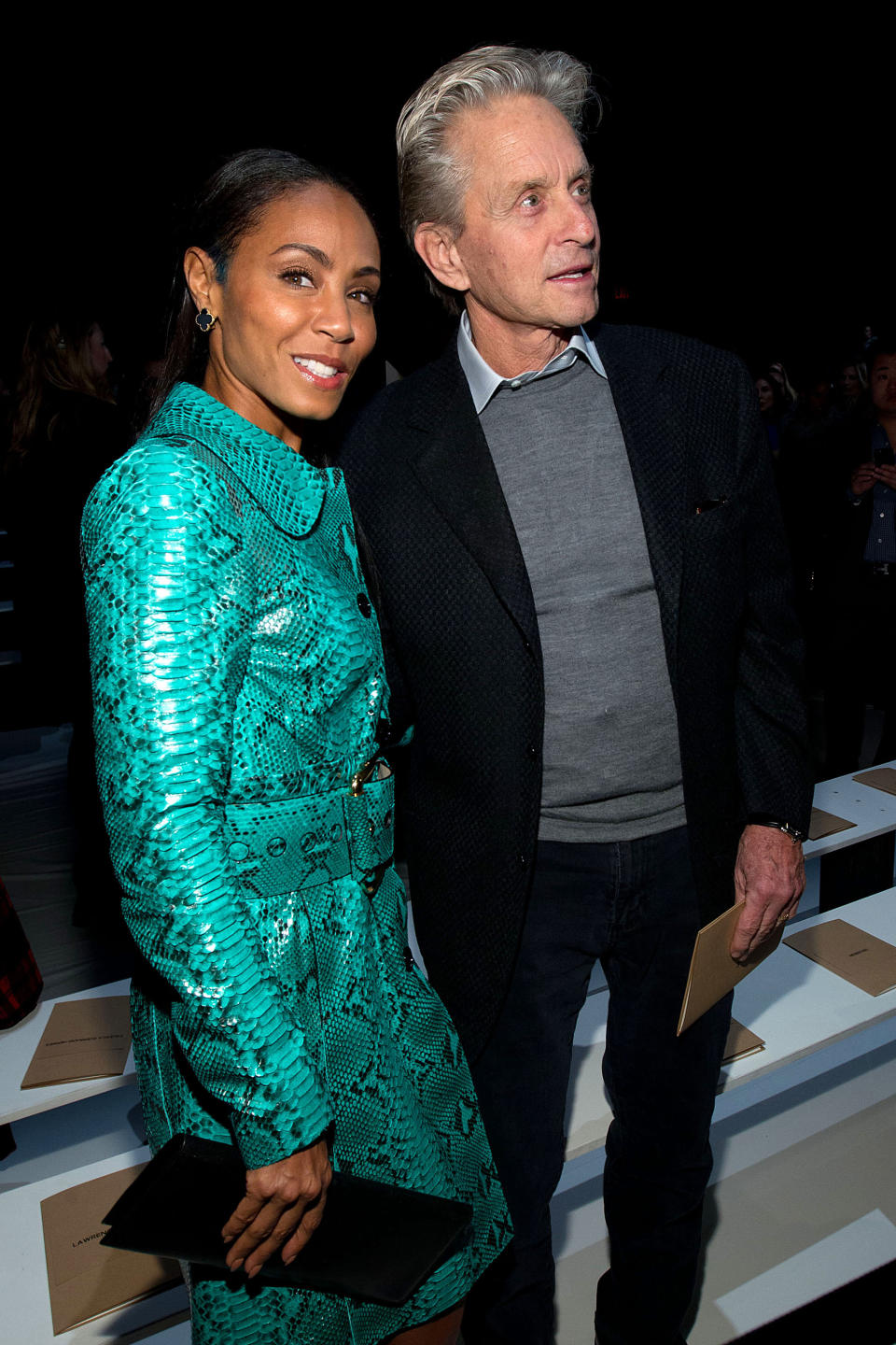 Jada Pinkett Smith, left, and Michael Douglas attend the Fall 2013 Michael Kors Runway Show, on Wednesday, Feb. 13, 2013 in New York. (Photo by Dario Cantatore/Invision/AP)