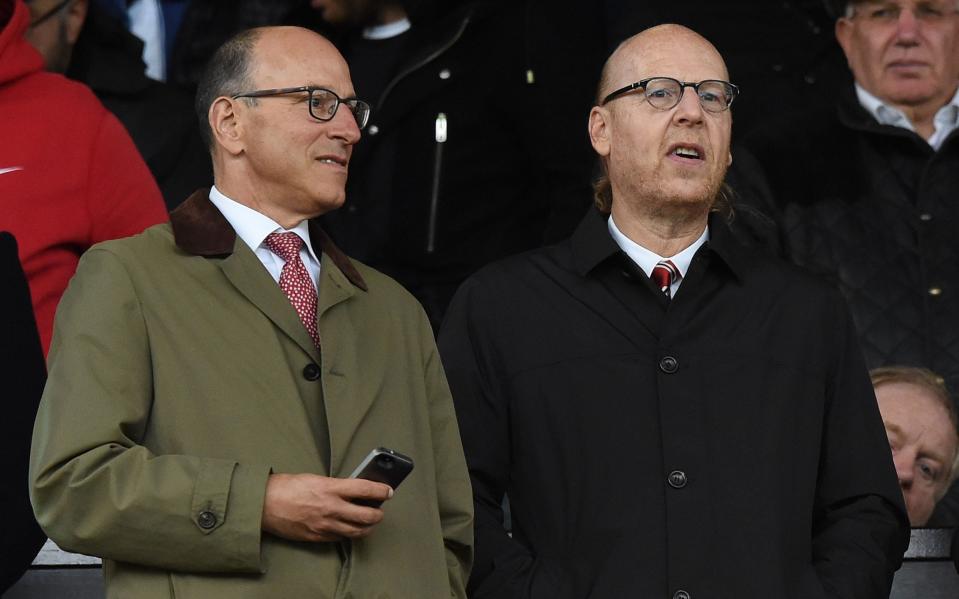 Joel Glazer (left) apologised to fans in an open letter after the Super League debacle - AFP